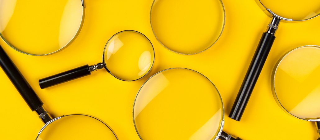 Magnifying glasses on a yellow background